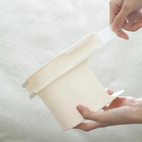 Tucking the sheet into the clip with the strip