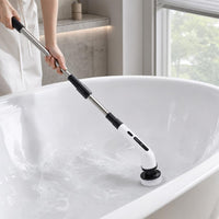 Scrubbing a bathtub standing up with the extendable handle