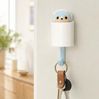 Squirrel wall hook holding house keys